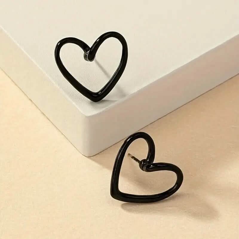 Glossy Hollow Heart Design Stud Earrings DailySale